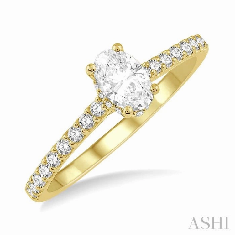 1/2 Ctw Round Cut Diamond Engagement Ring With 1/4 Ct Oval Cut Center Stone in 14K Yellow Gold