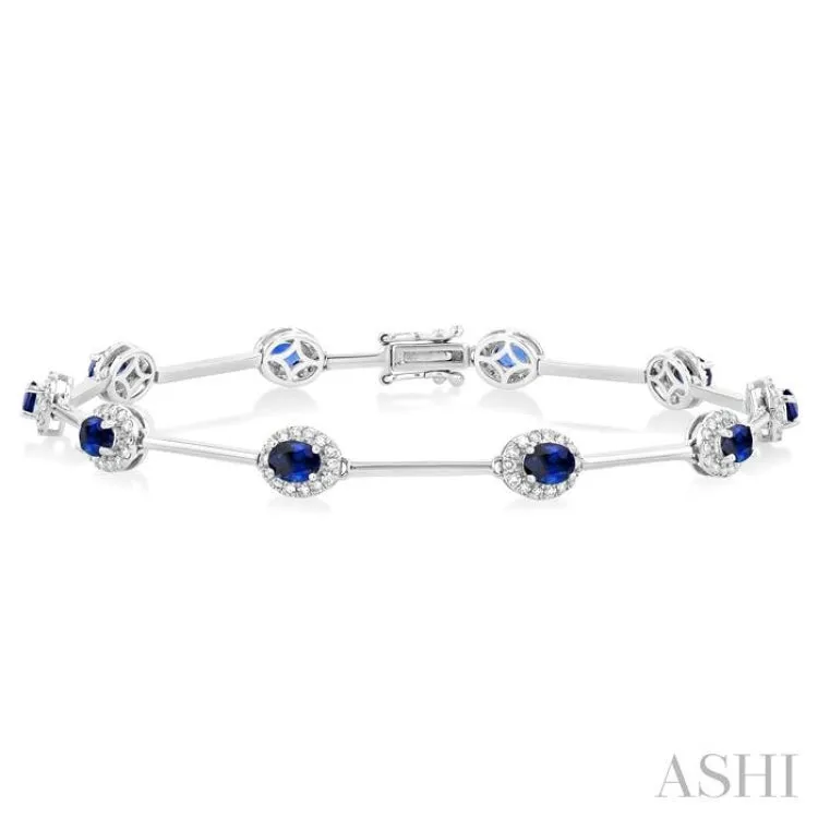 4x3 MM Oval Cut Sapphire and 1/2 Ctw Round Cut Diamond Halo Precious Bar Link Bracelet in 10K White Gold