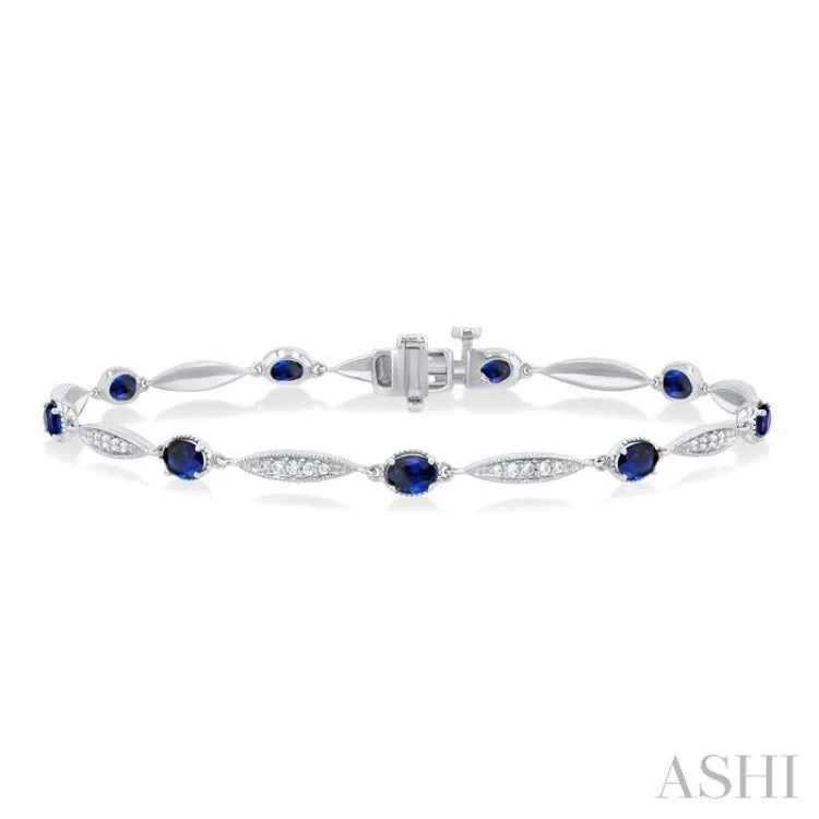 4X3 MM Oval Cut Sapphire and 1/4 Ctw Round Cut Diamond Precious Bracelet in 10K White Gold