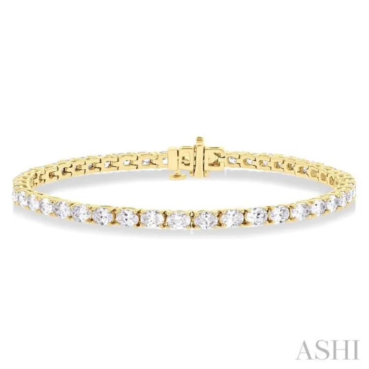 5 1/2 ctw East West Oval Cut Diamond Fashion Tennis bracelet in 14K Yellow Gold