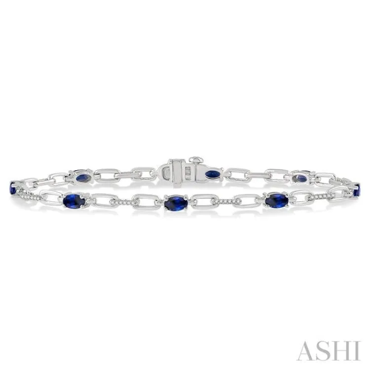 5x3 MM Oval Cut Sapphire and 1/6 ctw Round Cut Diamond Precious Bracelet in 10K White Gold