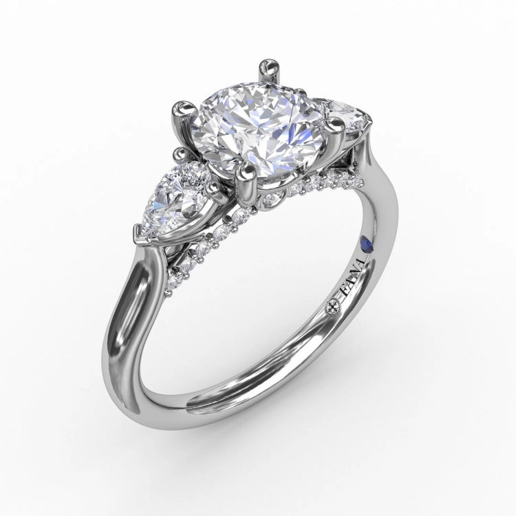 Classic Three-Stone Diamond Engagement Ring With Pear-Shape Side Diamonds