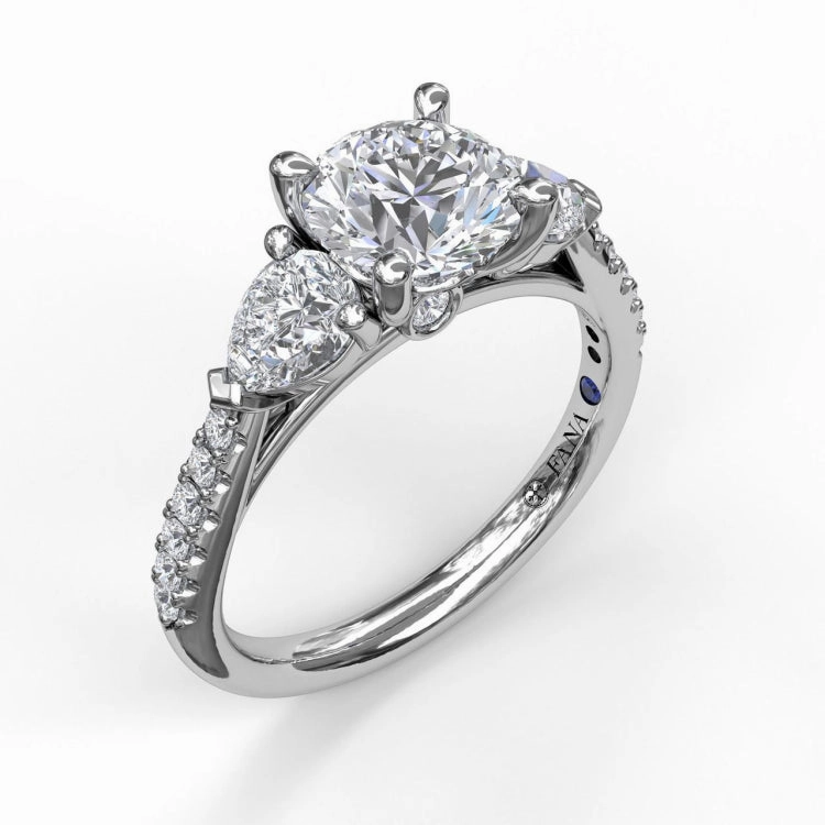 Three-Stone Engagement Ring With Pear Cut Side Stones